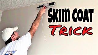 Drywall construction workers skim coating trick- Skim coat over texture